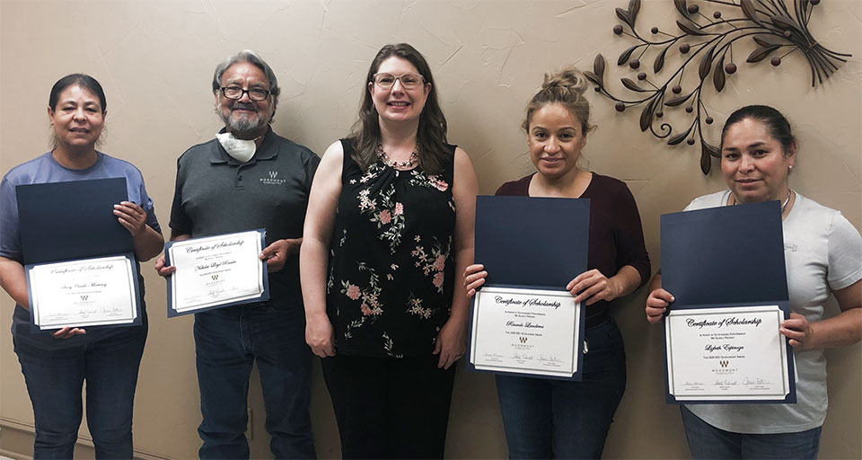 Jaime Tidwell Foster, VP of Business Development, with parents of the 2020 Student Scholarship Awards from Woodmont Cabinetry