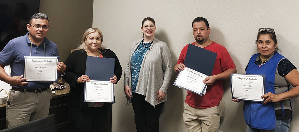 Jaime Tidwell Foster, VP of Business Development, with parents of the 2020 Student Scholarship Awards from Woodmont Cabinetry